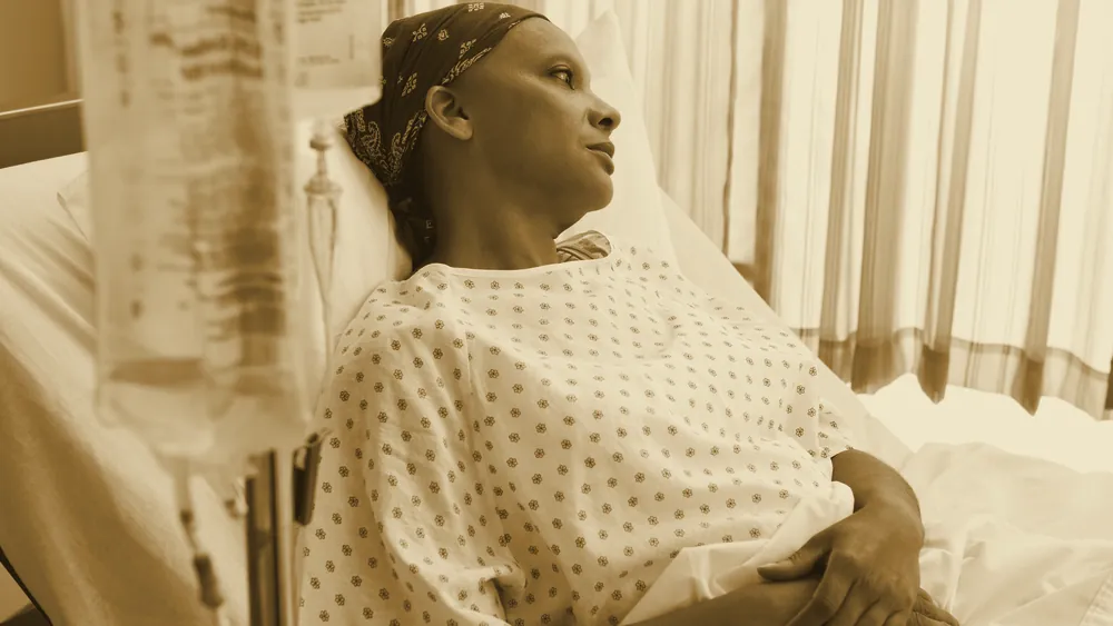 A female patient resting in a hospital bed
