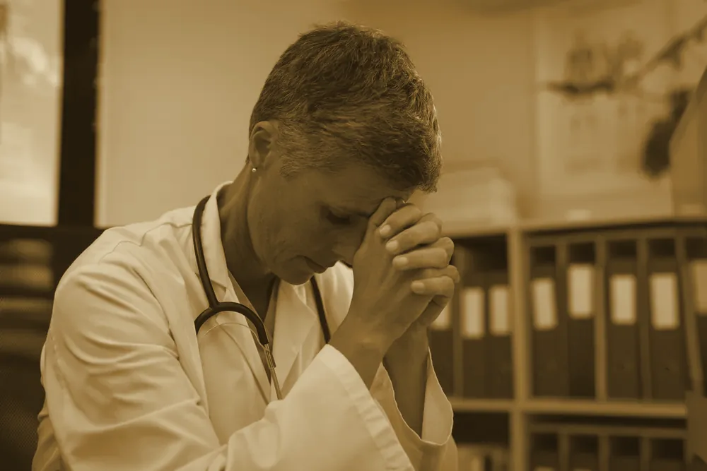 A woman sitting in quiet distress