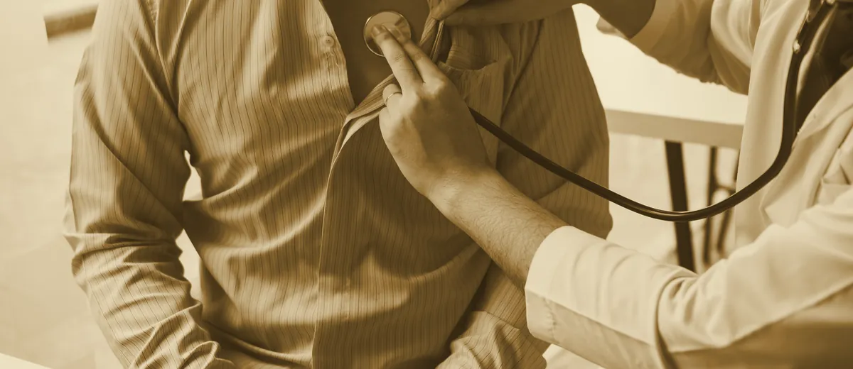 A physician examining a patient with a stethoscope, illustrating the duty of care at the heart of medical malpractice law