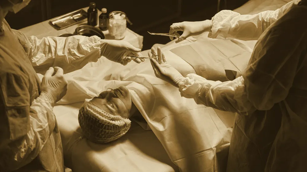 A surgical team performing an operation in a hospital operating room